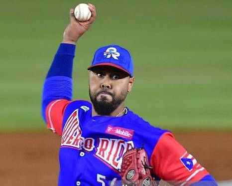 Adalberto Flores of Puerto Rico?s Cangrejeros de San Turce throws the ball against Panama's Toros de Herrera during the Caribbean Series baseball tournament at the Rod Carew stadium in Panama City on February 9, 2019. (Photo by Luis ACOSTA / AFP) (Photo credit should read LUIS ACOSTA/AFP via Getty Images)